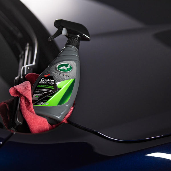 Turtle Wax Hybrid Solutions Ceramic Spray Coating on a car with a microfiber cloth. Detailing, car care, hydrophobic protection.